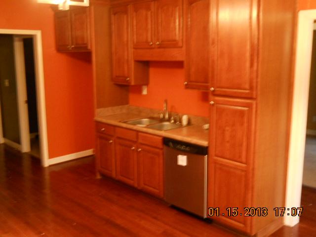 675 Sugar Flat Road Lebanon, TN 37087 - Photo 5 of 20 a kitchen with granite countertop wooden cabinets and a sink