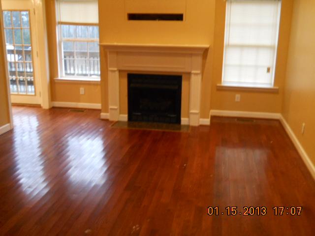 675 Sugar Flat Road Lebanon, TN 37087 - Photo 6 of 20 a view of an empty room with wooden floor and a window