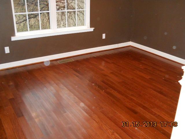 675 Sugar Flat Road Lebanon, TN 37087 - Photo 7 of 20 a view of an empty room with wooden floor and windows