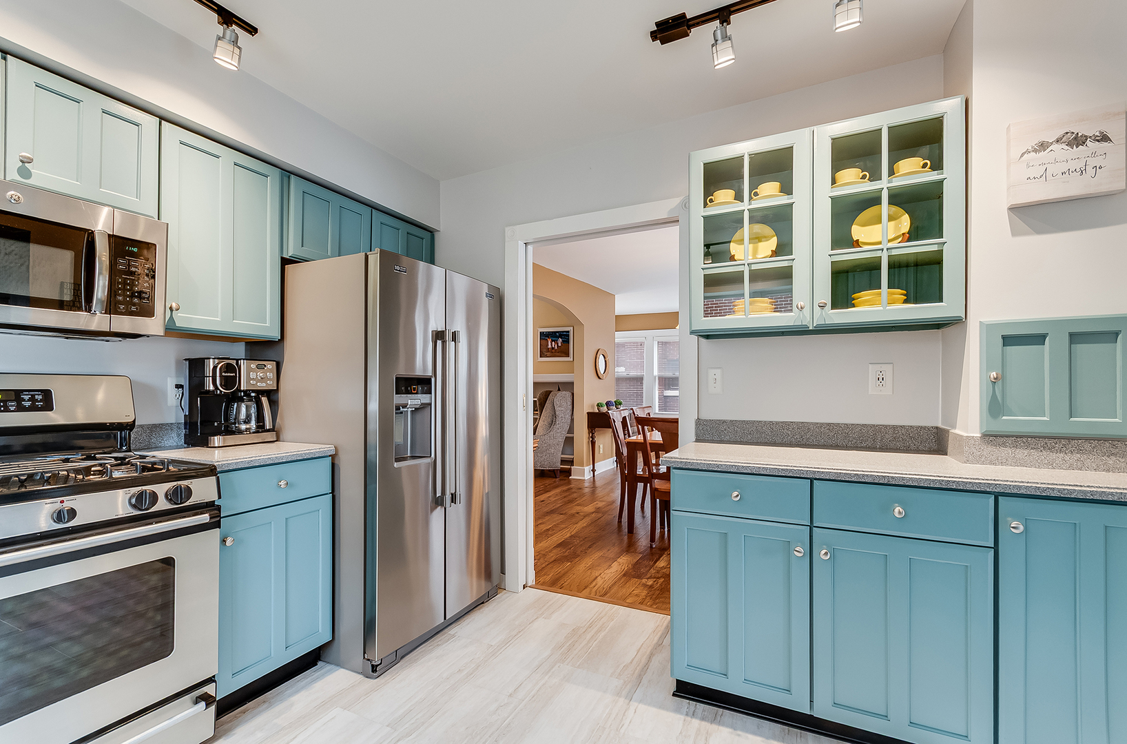 409 Cornelia Street Joliet, IL 60435 - Photo 9 of 27 a kitchen with stainless steel appliances a refrigerator stove and cabinets