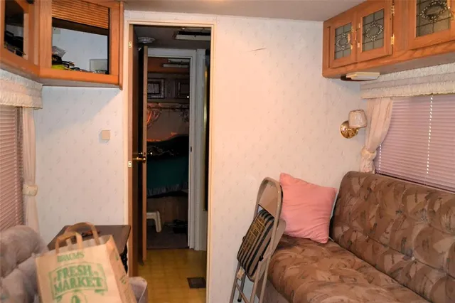 a kitchen with a sink a stove and cabinets