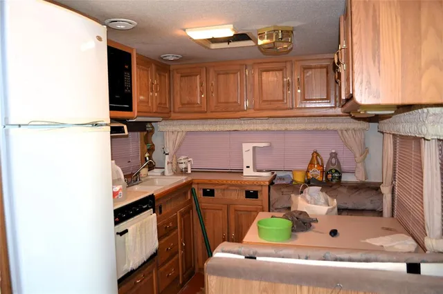 a kitchen with a stove and a microwave