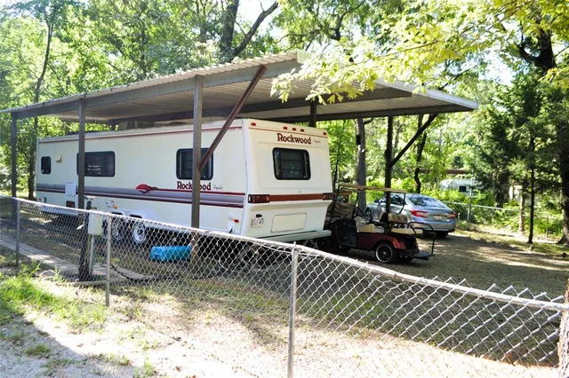 a view of a house with a sink and wooden floor