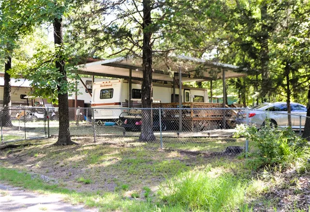 a backyard of a house with yard barbeque oven and outdoor seating
