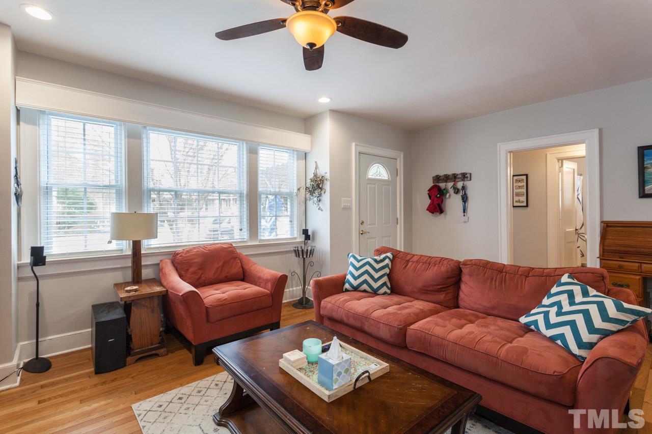 605 Dixie Trail Raleigh, NC 27607 - Photo 3 of 20 a living room with furniture and a large window