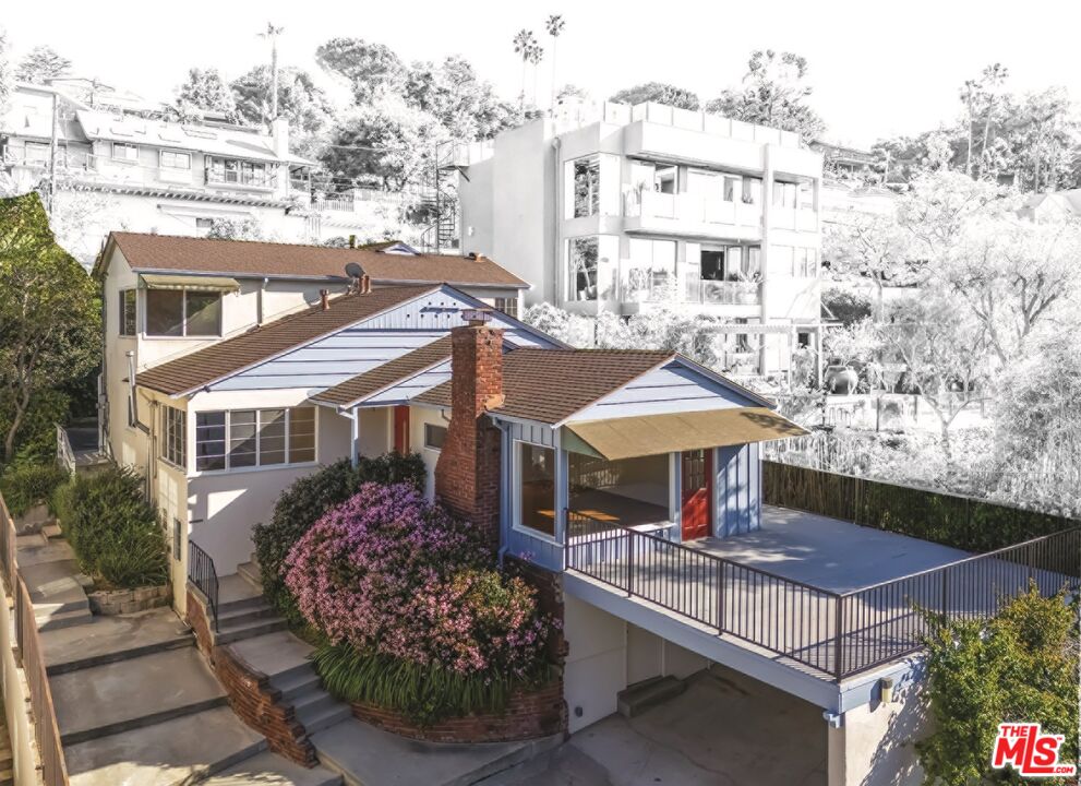 2106 Rockford Road Los Angeles, CA 90039 - Photo 1 of 66 a front view of a building with table and chairs