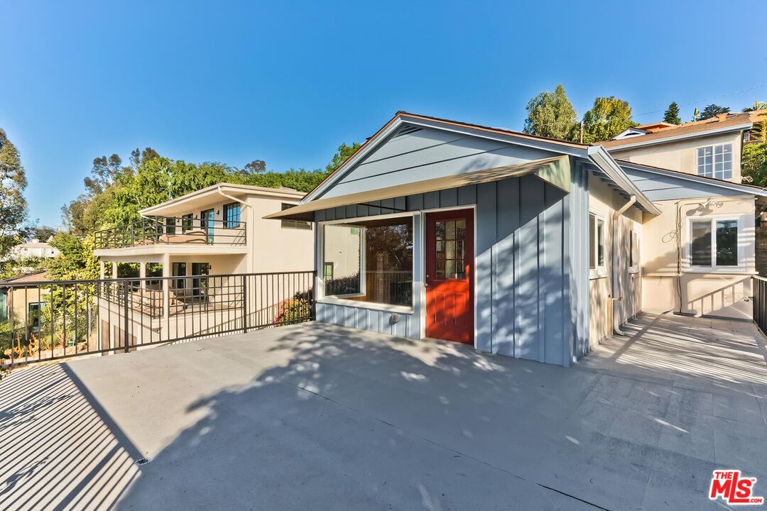 2106 Rockford Road Los Angeles, CA 90039 - Photo 18 of 66 a view of a house with a large window and wooden fence