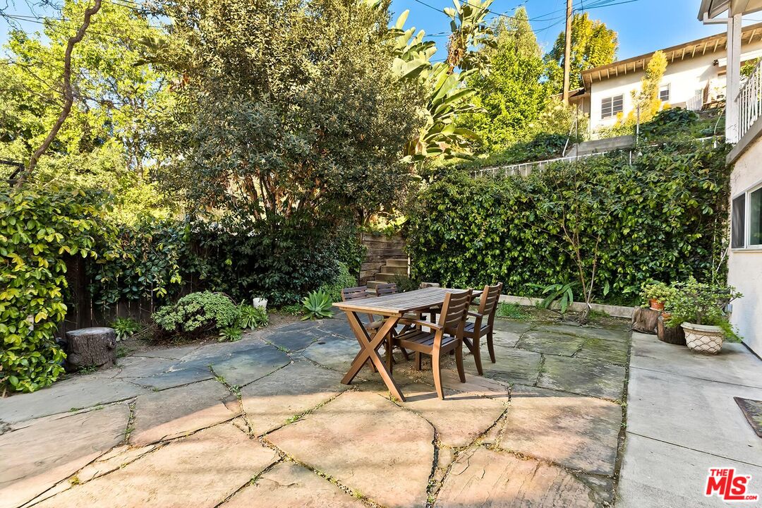 2106 Rockford Road Los Angeles, CA 90039 - Photo 24 of 66 a view of a patio with table and chairs and potted plants