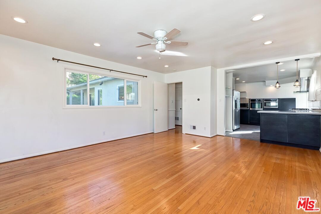 2106 Rockford Road Los Angeles, CA 90039 - Photo 26 of 66 a view of an empty room with a kitchen and a window
