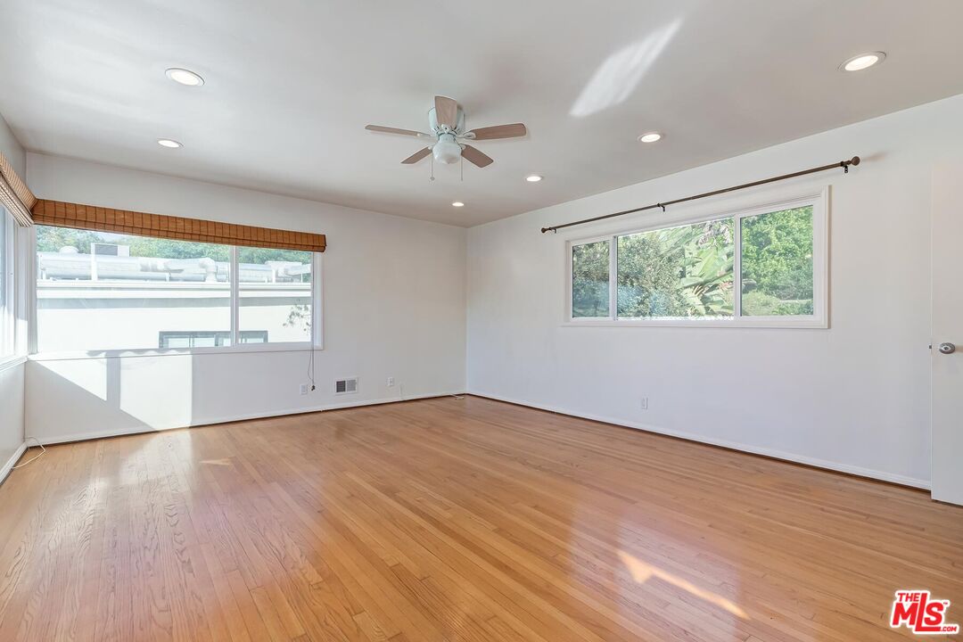 2106 Rockford Road Los Angeles, CA 90039 - Photo 27 of 66 a view of an empty room with wooden floor and a window