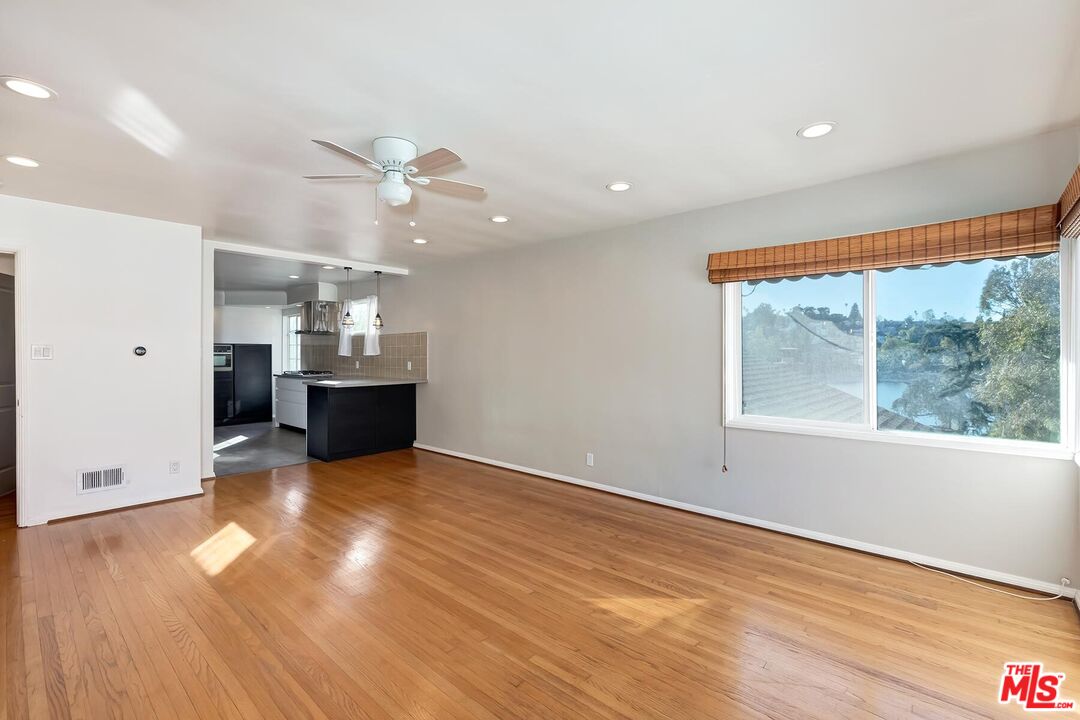2106 Rockford Road Los Angeles, CA 90039 - Photo 28 of 66 wooden floor in an empty room with a window