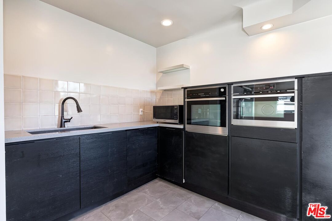 2106 Rockford Road Los Angeles, CA 90039 - Photo 32 of 66 a kitchen with a sink and cabinets