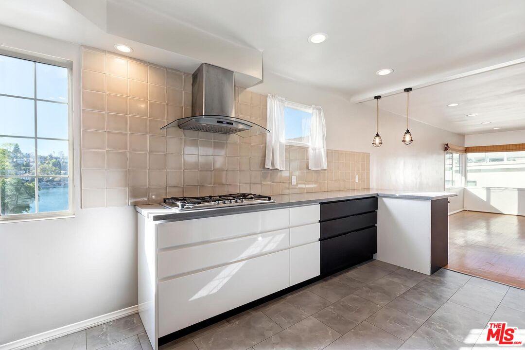 2106 Rockford Road Los Angeles, CA 90039 - Photo 33 of 66 a kitchen with stainless steel appliances granite countertop a stove a sink and a refrigerator