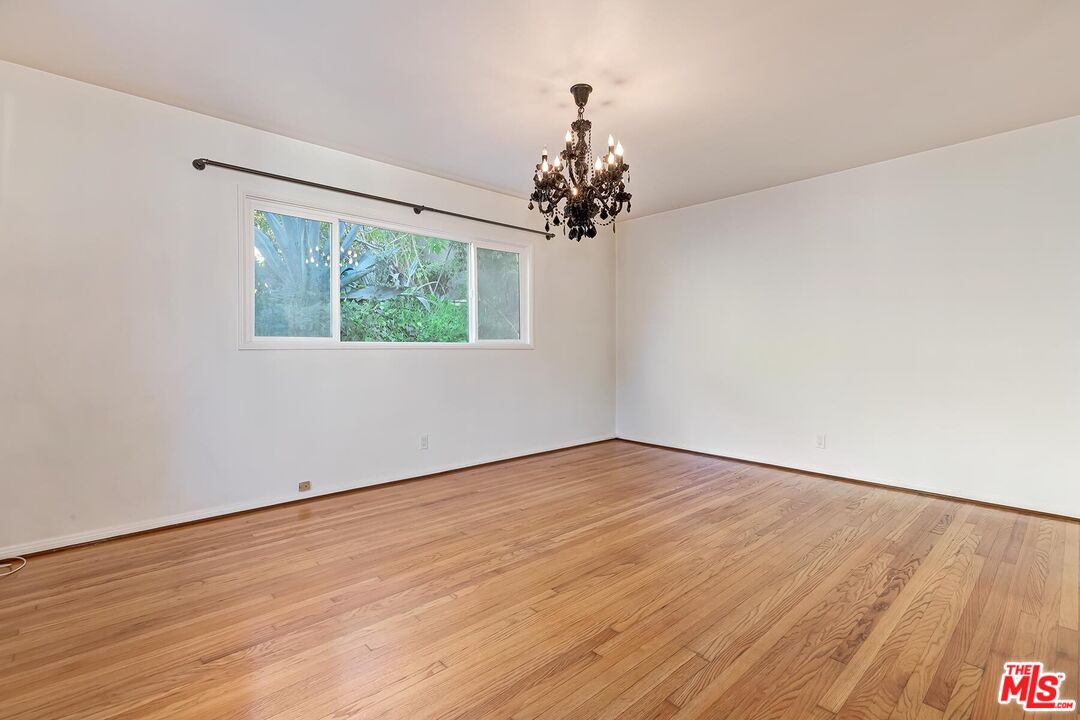 2106 Rockford Road Los Angeles, CA 90039 - Photo 35 of 66 wooden floor in an empty room with a window