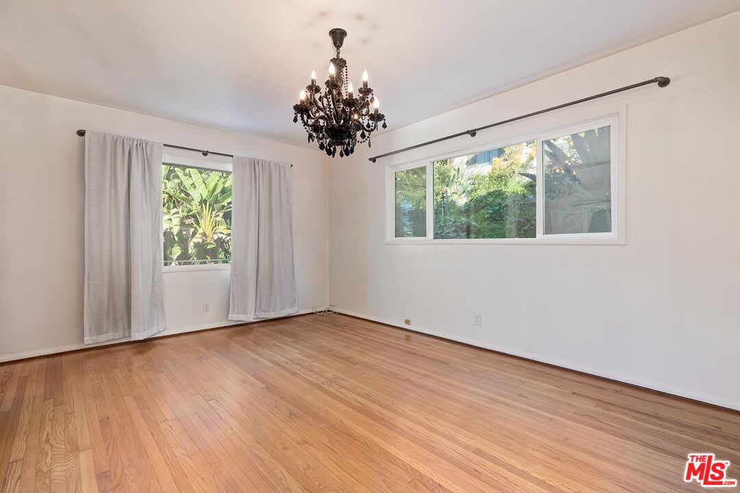 2106 Rockford Road Los Angeles, CA 90039 - Photo 36 of 66 a view of an empty room with wooden floor and a window
