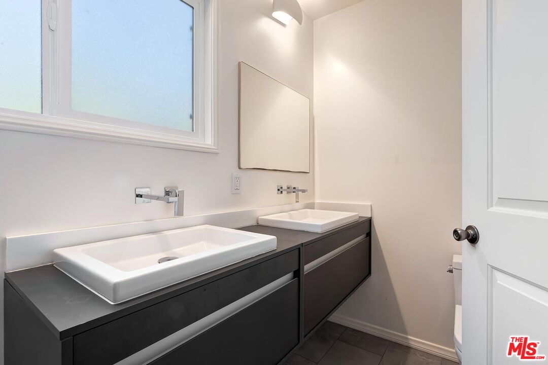 2106 Rockford Road Los Angeles, CA 90039 - Photo 38 of 66 a bathroom with a sink and a mirror