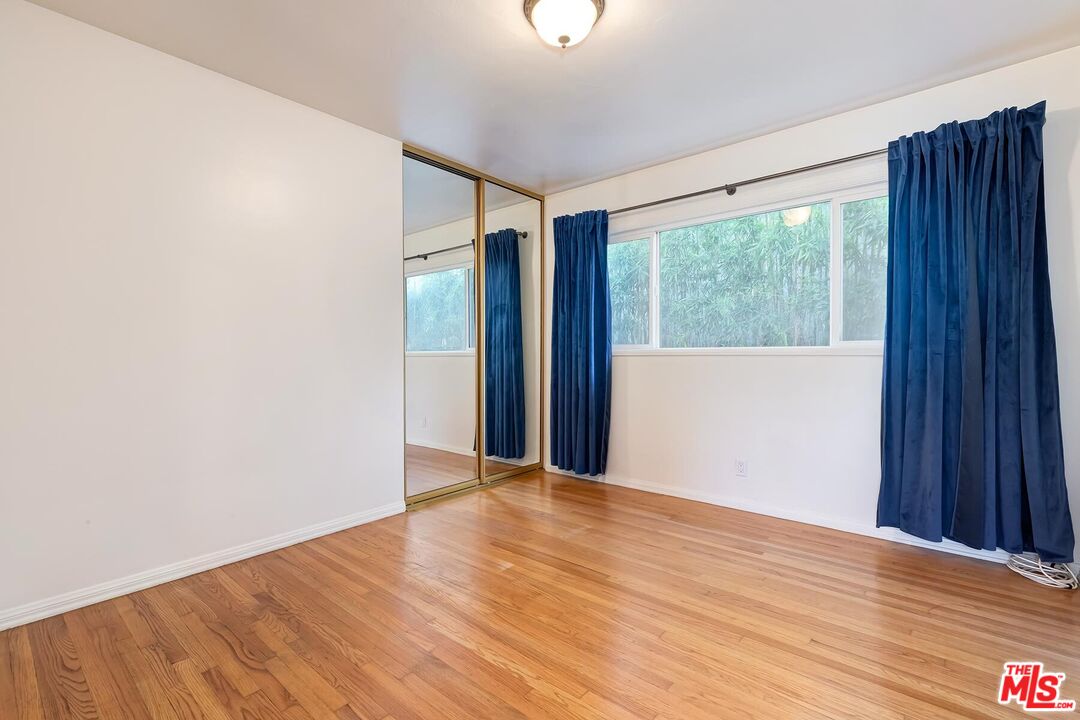 2106 Rockford Road Los Angeles, CA 90039 - Photo 40 of 66 a view of an empty room with wooden floor and a window