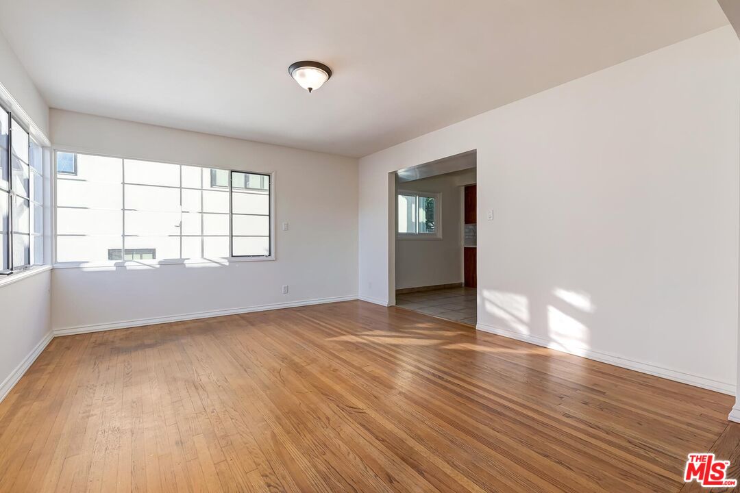2106 Rockford Road Los Angeles, CA 90039 - Photo 54 of 66 an empty room with wooden floor and windows