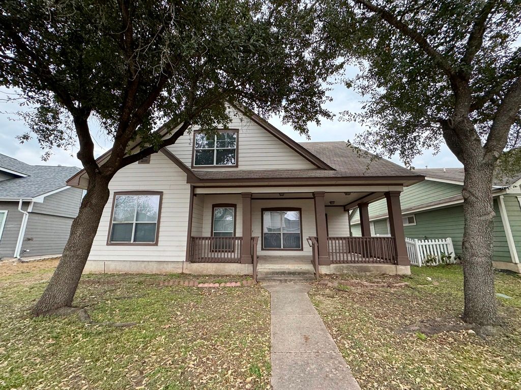 544 Hogan Kyle, TX 78640 - Photo 1 of 40 a front view of a house with garden