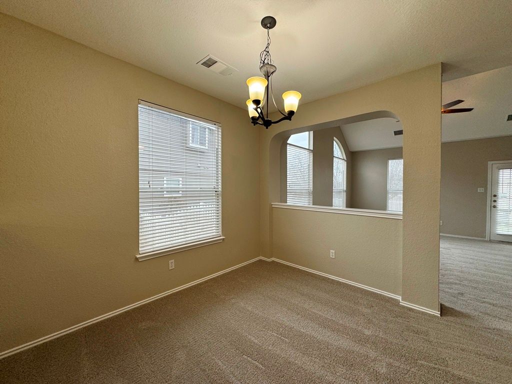 544 Hogan Kyle, TX 78640 - Photo 14 of 40 a view of an empty room with a window