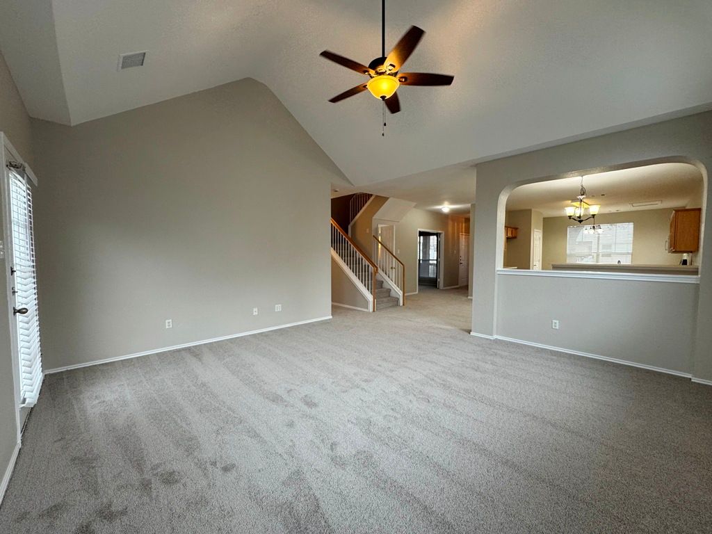 544 Hogan Kyle, TX 78640 - Photo 17 of 40 wooden floor in an empty room with a window