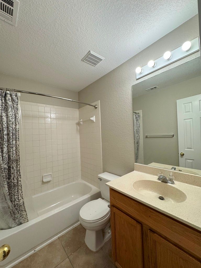 544 Hogan Kyle, TX 78640 - Photo 27 of 40 a bathroom with a sink a toilet and shower
