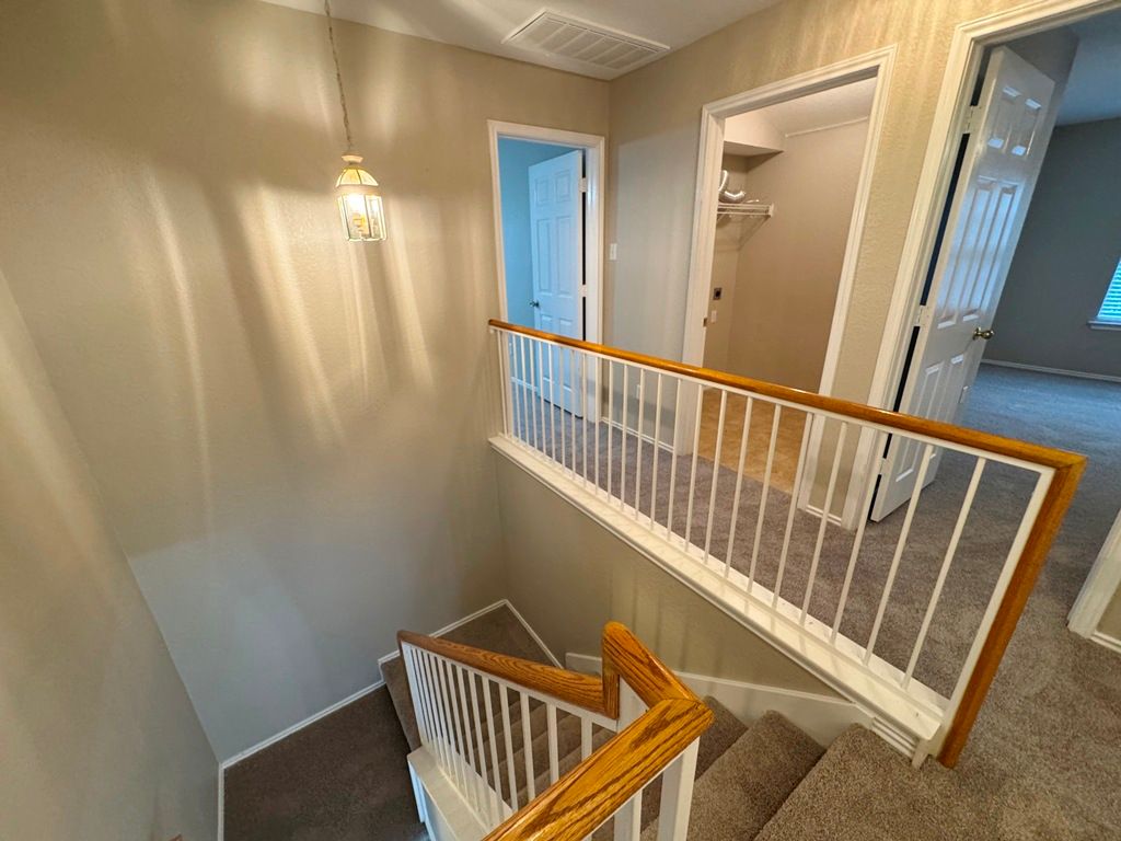 544 Hogan Kyle, TX 78640 - Photo 29 of 40 a view of a hallway with staircase