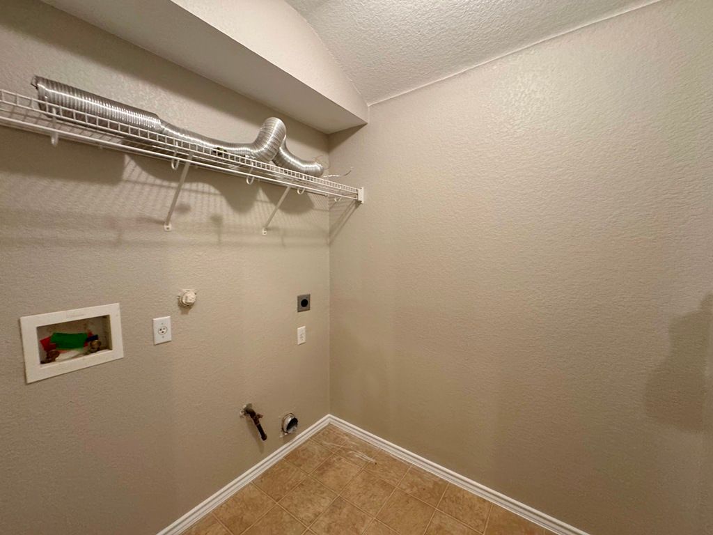 544 Hogan Kyle, TX 78640 - Photo 30 of 40 a view of a room with rack on the wall