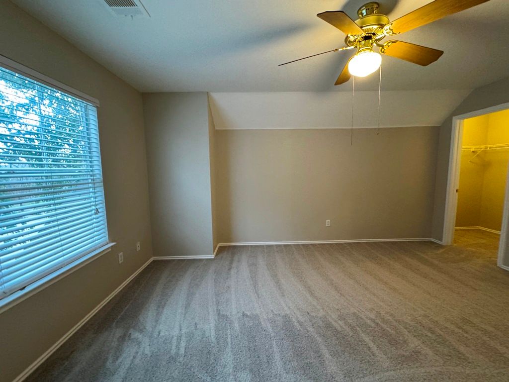 544 Hogan Kyle, TX 78640 - Photo 32 of 40 wooden floor in an empty room with a window