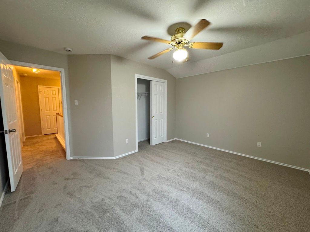544 Hogan Kyle, TX 78640 - Photo 36 of 40 wooden floor in an empty room and chandelier fan