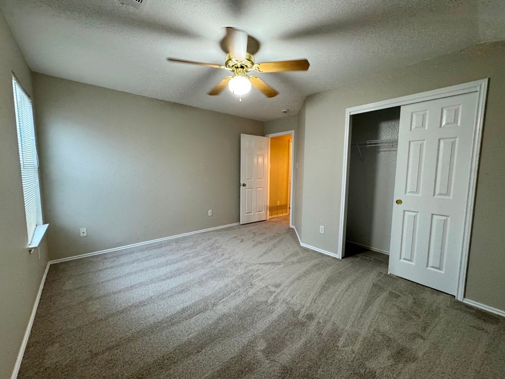 544 Hogan Kyle, TX 78640 - Photo 37 of 40 an empty room with fan and fan