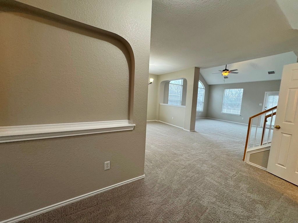 544 Hogan Kyle, TX 78640 - Photo 6 of 40 a view of an empty room with stairs