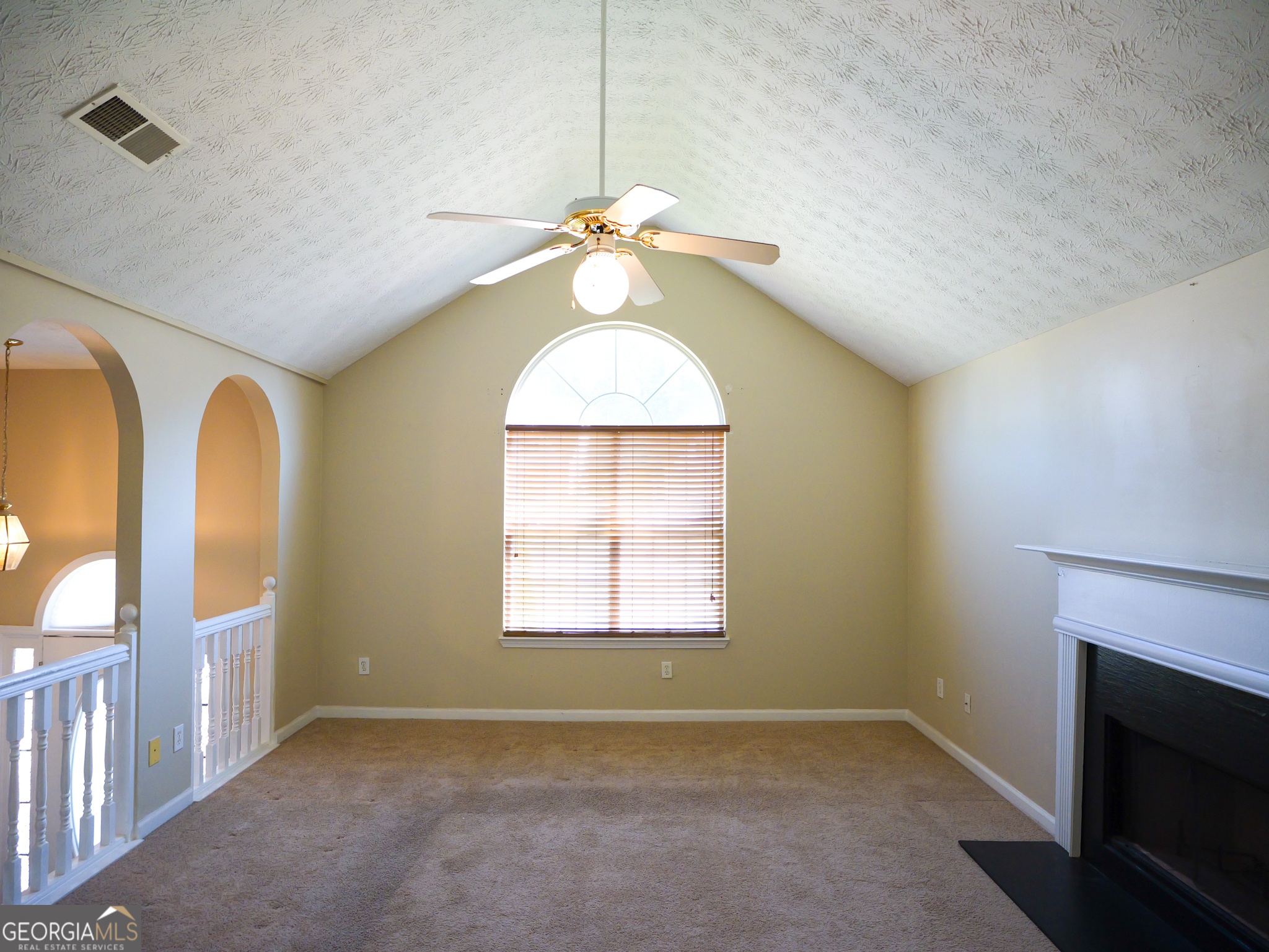 11036 Pebble Ridge Drive Hampton, GA 30228 - Photo 6 of 35 an empty room with windows and fan