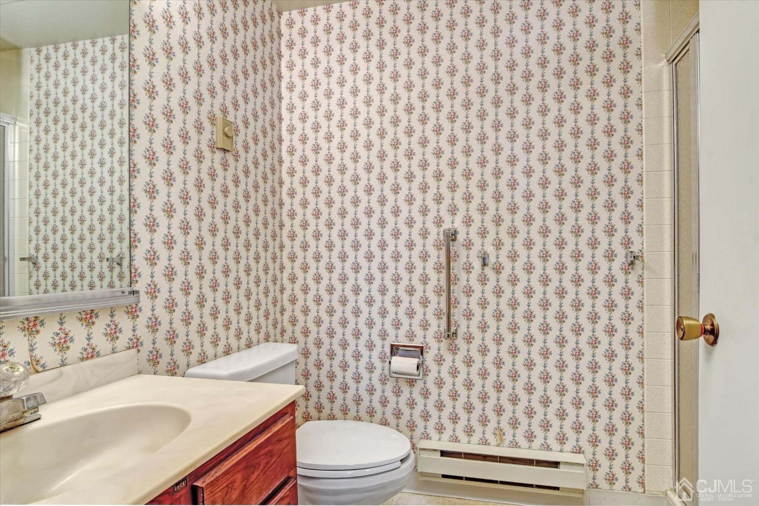 569 Old Nassau Road, Unit O Iselin, NJ 08830 - Photo 16 of 38 a bathroom with a sink and toilet
