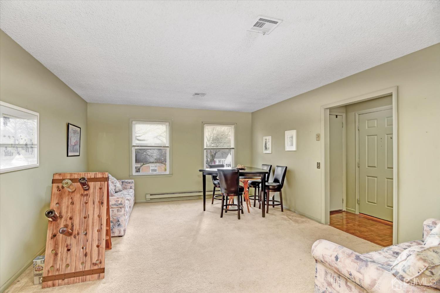 569 Old Nassau Road, Unit O Iselin, NJ 08830 - Photo 3 of 38 a dining room with furniture and window