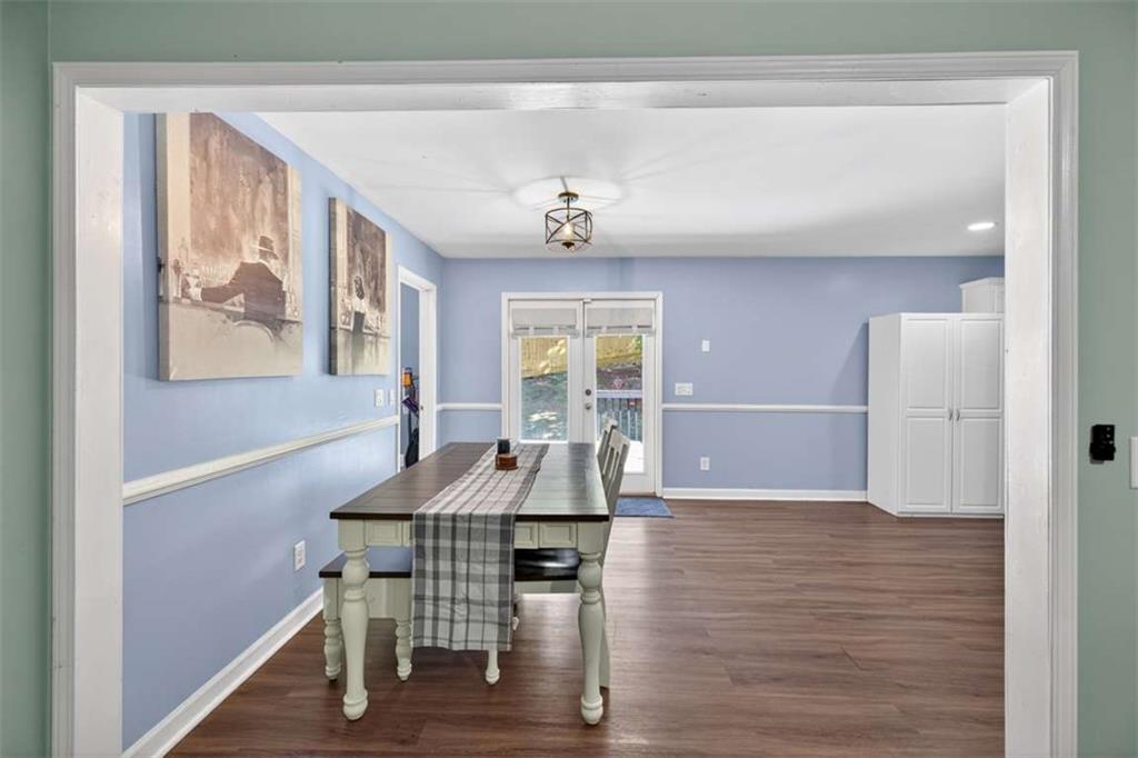 386 Ridgewood Drive Pendergrass, GA 30567 - Photo 10 of 50 a view of a dining room with furniture window and wooden floor
