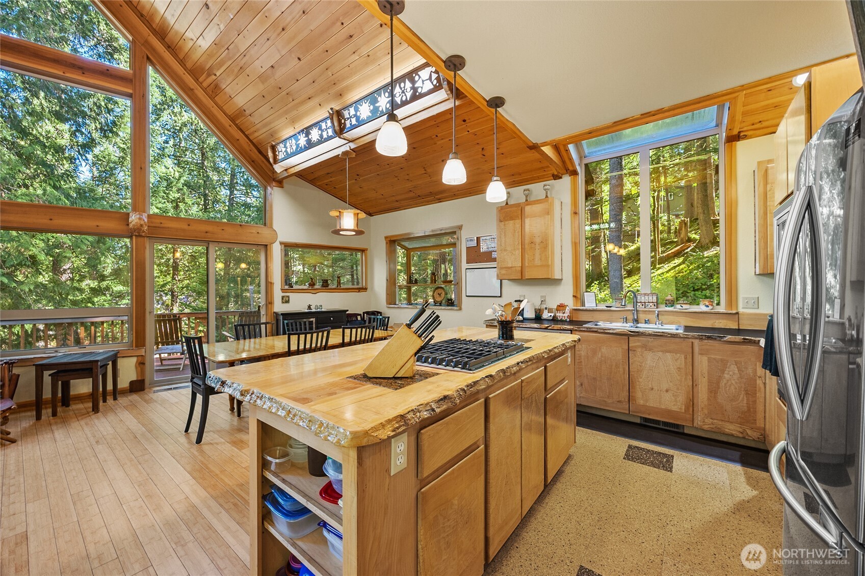 106 Timber Trail Packwood, WA 98361 - Photo 11 of 40 a kitchen with a stove a sink a refrigerator and wooden floor