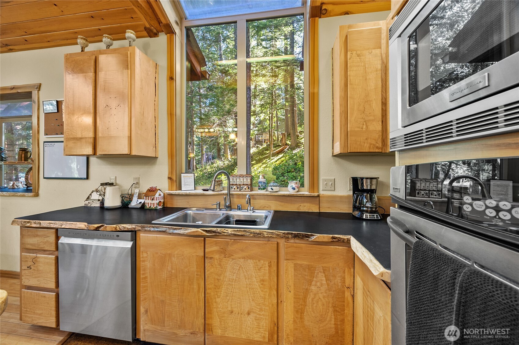 106 Timber Trail Packwood, WA 98361 - Photo 14 of 40 a kitchen with a sink a counter top space and a window