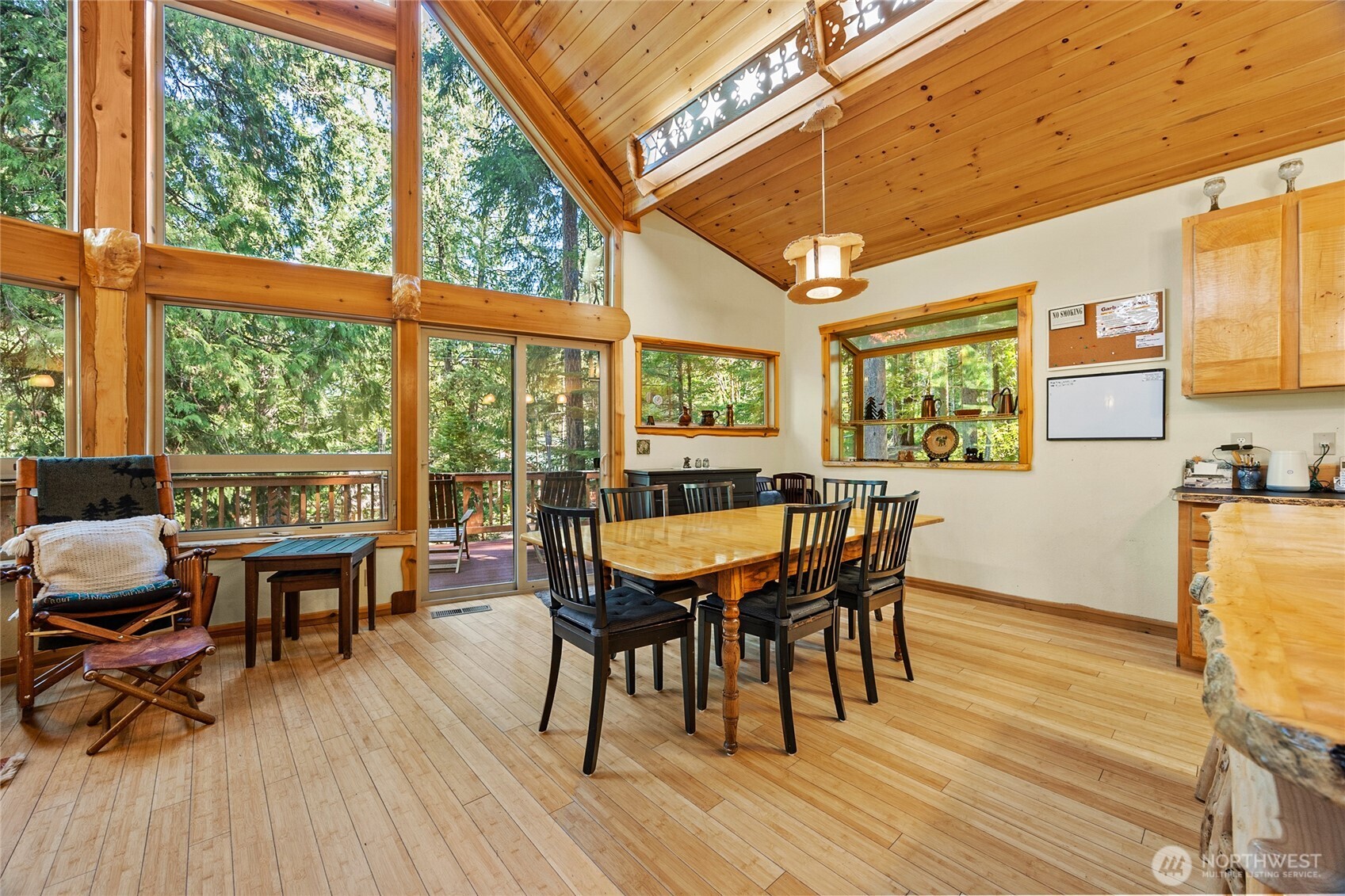 106 Timber Trail Packwood, WA 98361 - Photo 16 of 40 a dining room with furniture window wooden floor