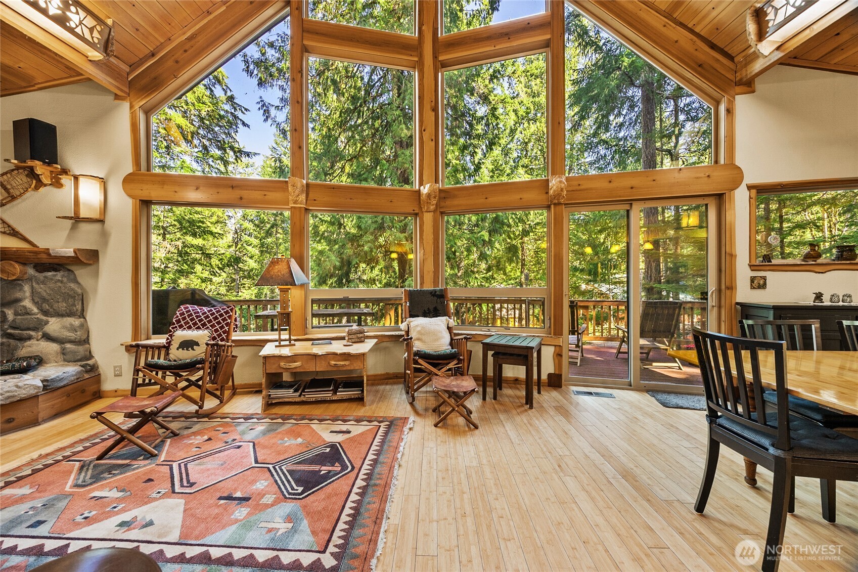 106 Timber Trail Packwood, WA 98361 - Photo 20 of 40 a living room with large windows and wooden floor