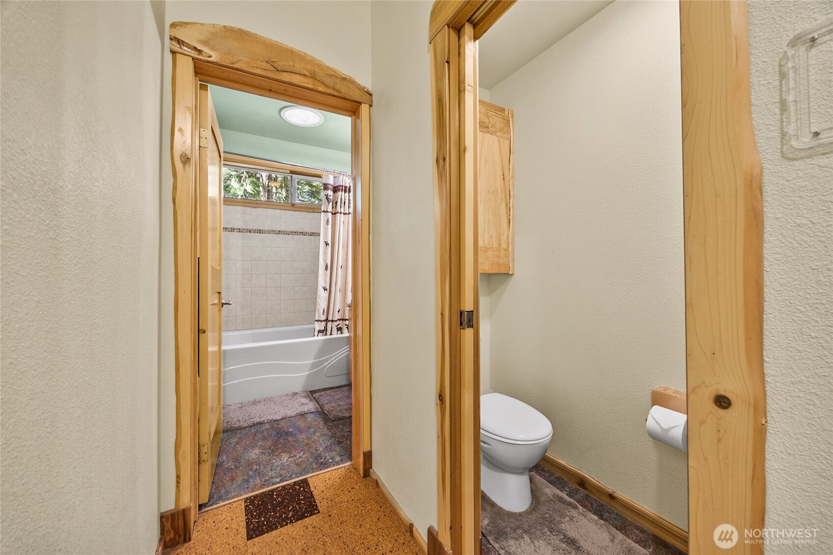 106 Timber Trail Packwood, WA 98361 - Photo 26 of 40 a bathroom with a granite countertop toilet and a shower
