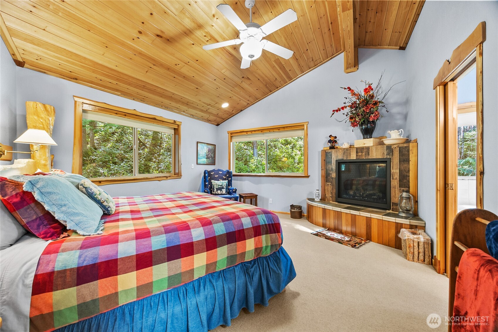 106 Timber Trail Packwood, WA 98361 - Photo 31 of 40 a bedroom with a bed and a flat screen tv