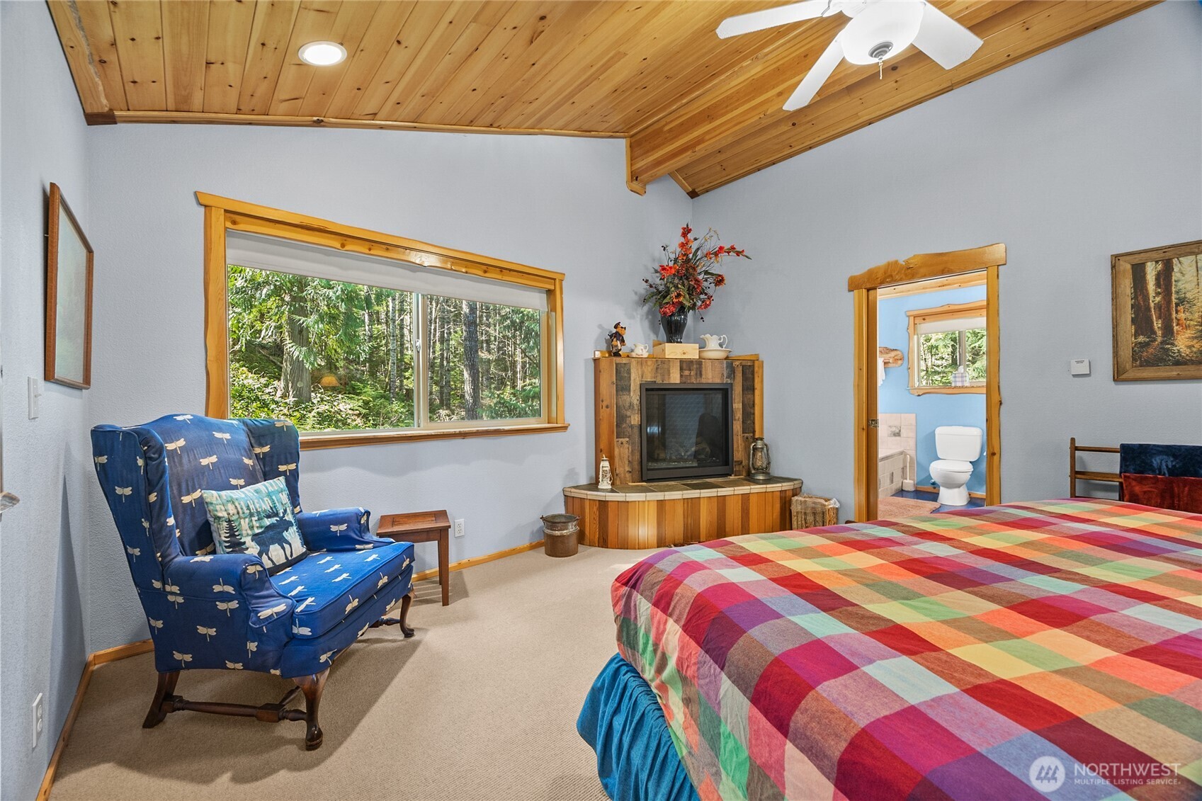 106 Timber Trail Packwood, WA 98361 - Photo 33 of 40 a bedroom with a bed and wooden floor