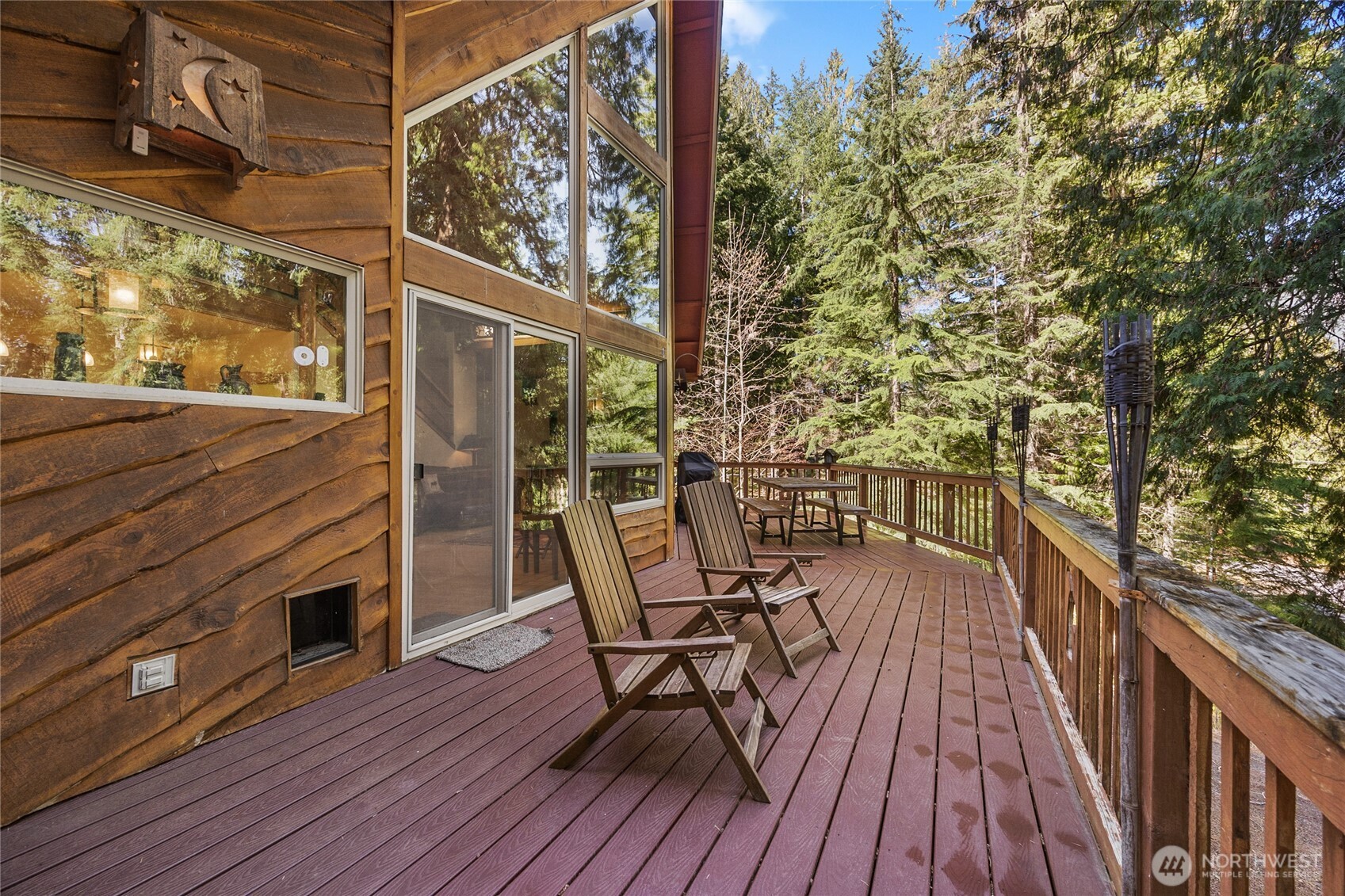 106 Timber Trail Packwood, WA 98361 - Photo 38 of 40 a view of a balcony with chairs and wooden floor
