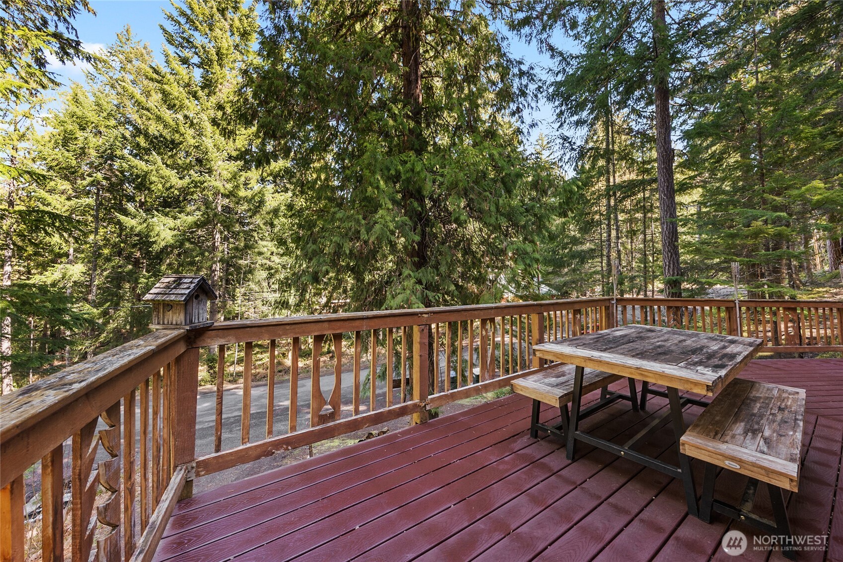 106 Timber Trail Packwood, WA 98361 - Photo 39 of 40 a view of a balcony with wooden floor and outdoor seating