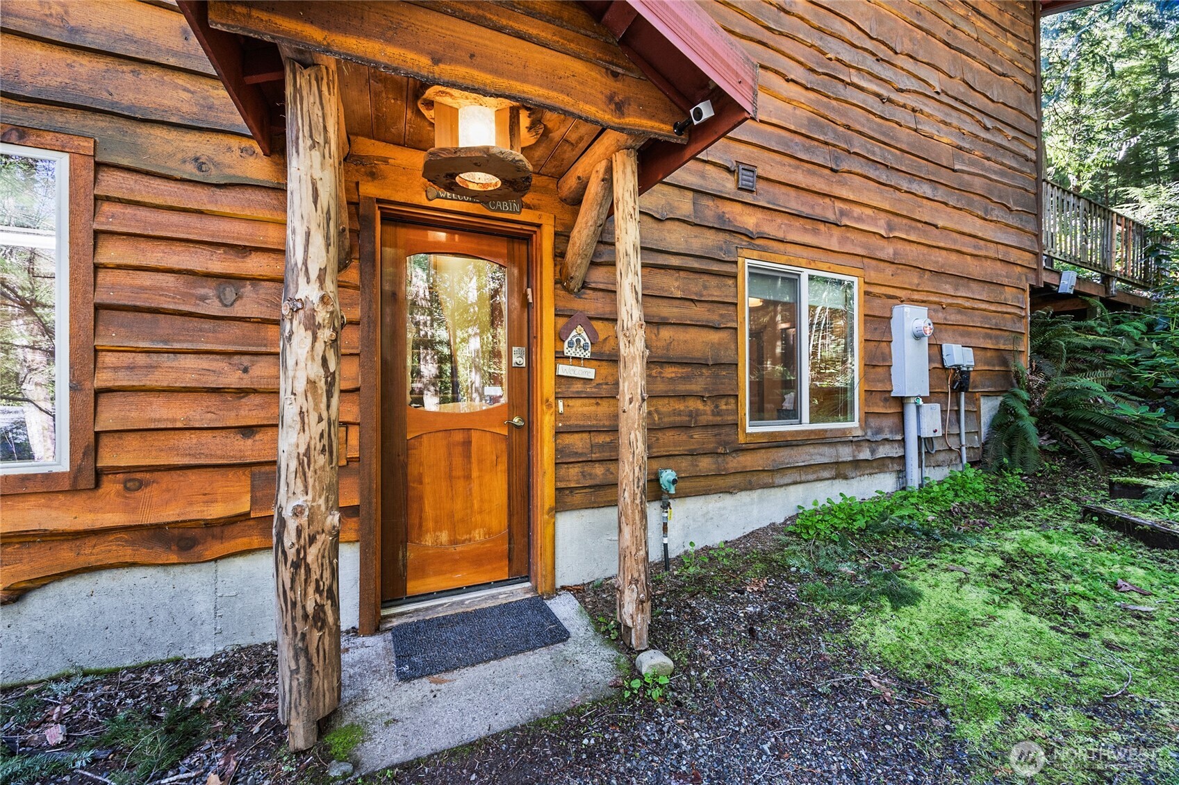 106 Timber Trail Packwood, WA 98361 - Photo 4 of 40 a view of a house with a door and wooden walls