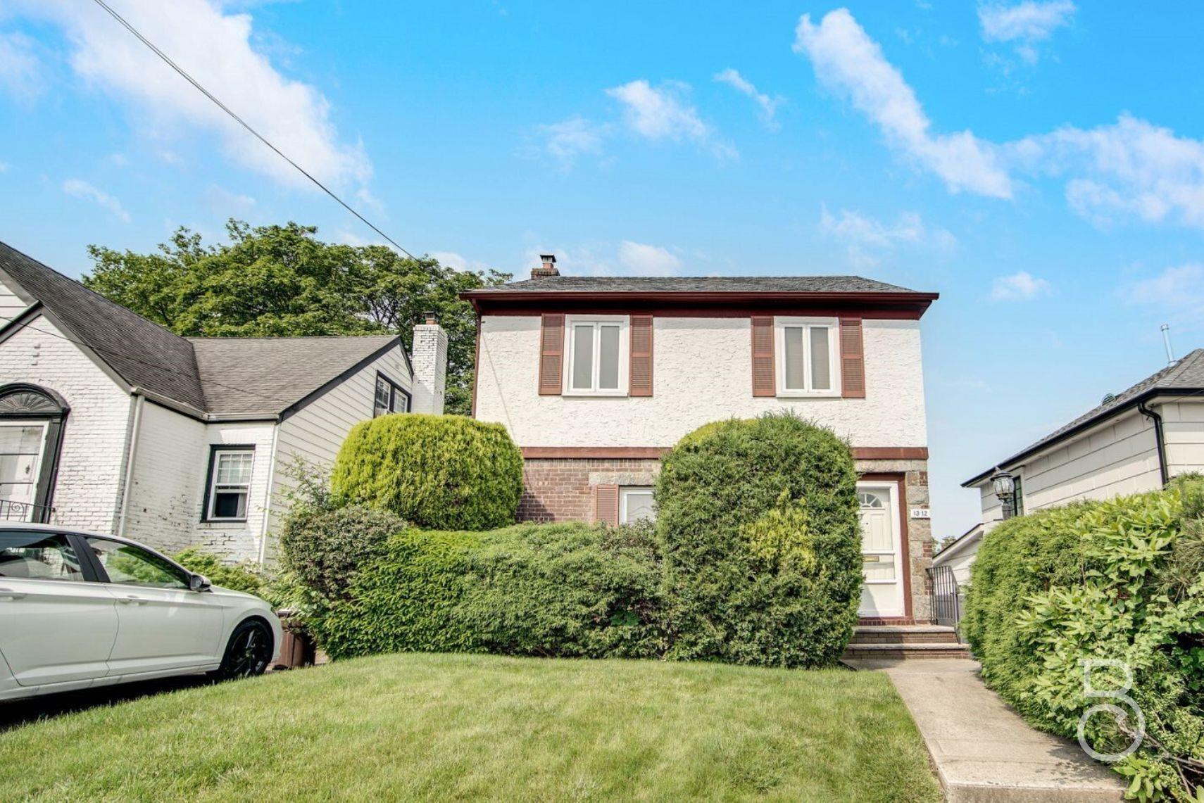 a house view with a garden space