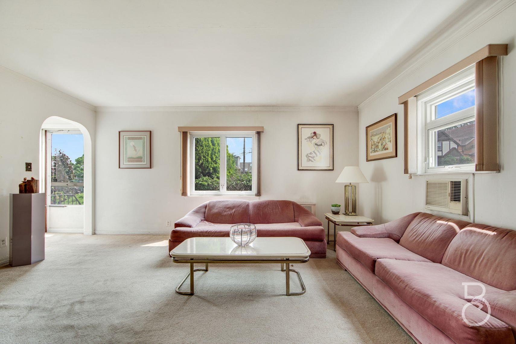 13-12 146th Street Queens, NY 11357 - Photo 3 of 11 a living room with furniture and a rug