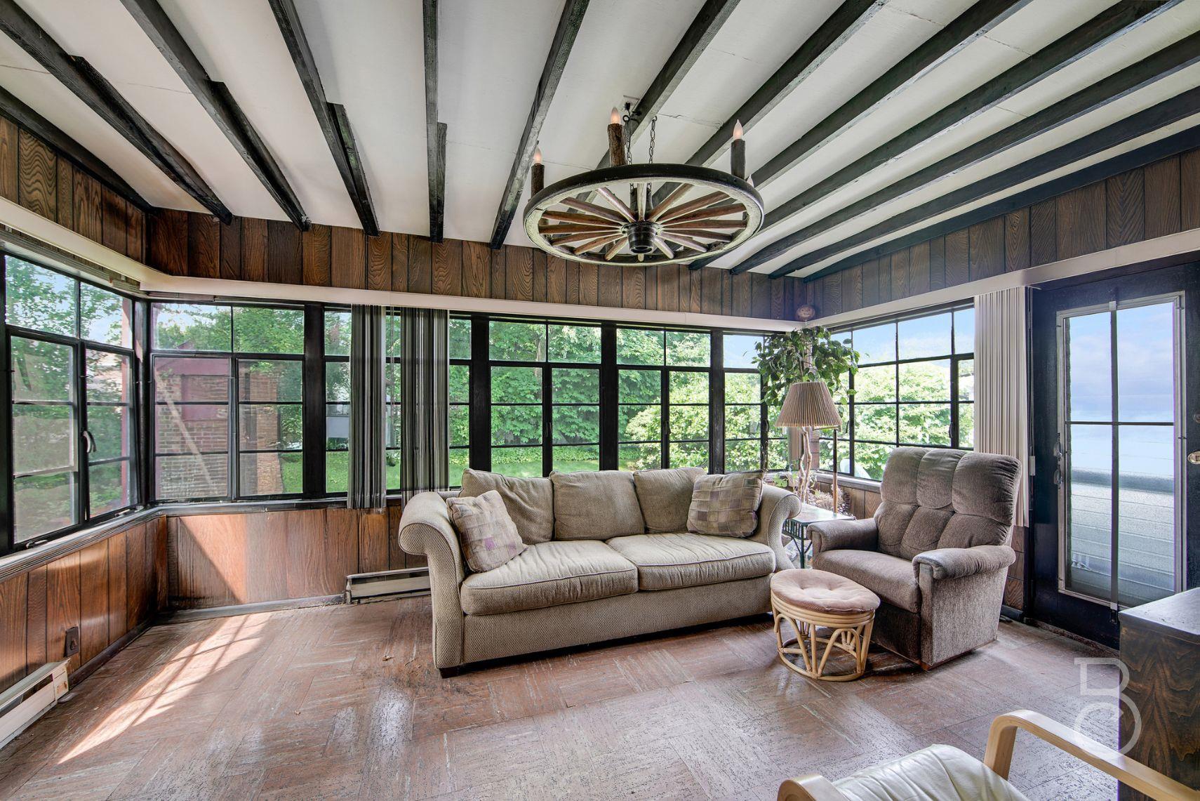 13-12 146th Street Queens, NY 11357 - Photo 10 of 11 a living room with furniture and a large window