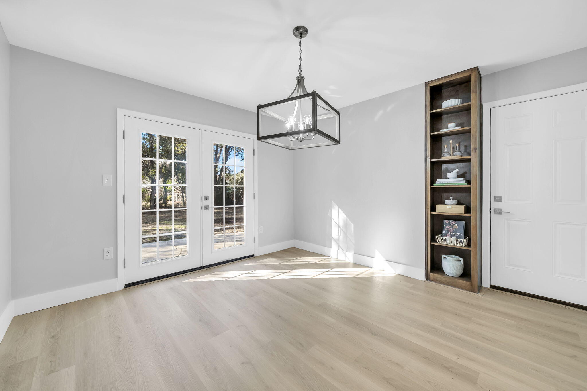 34 Hickory Avenue Shalimar, FL 32579 - Photo 17 of 57 a view of an empty room with a window and wooden floor